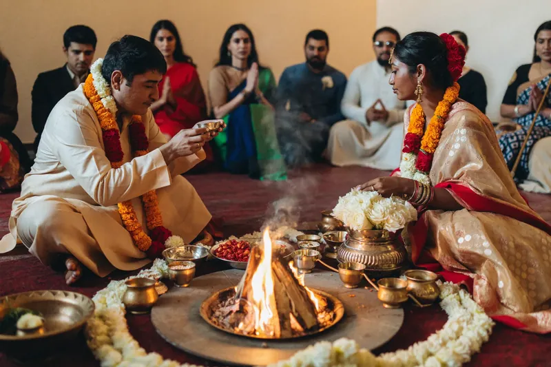 Wedding couple beside a ceremonial fire
