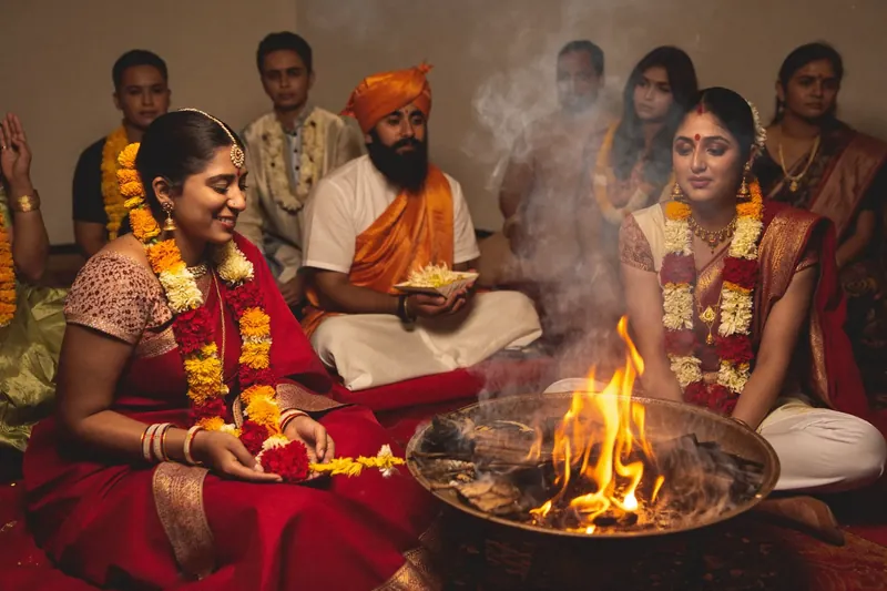 Family gathered beside a ceremonial fire
